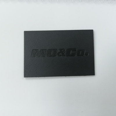 Αποτυπωμένο σε ανάγλυφο λογότυπων σουέτ Microfiber PU δέρματος χρώμα συνήθειας ετικετών Washable