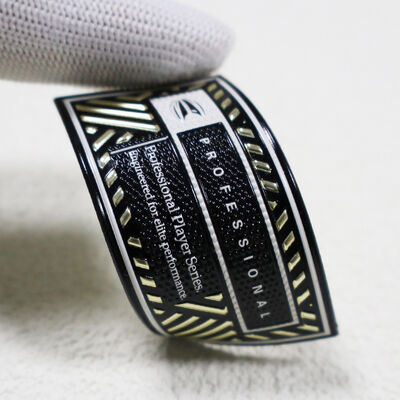 Προσαρμοσμένο έμπλαστρο TPU υψηλής συχνότητας - Μεταλλικό χρυσό & μαύρο σήμα επαγγελματία παίκτη για αθλητικά ρούχα